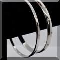 J065. 2 Silver bangles with Swarovski crystal studs. - $24 